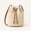 Cream woven bucket bag with tan leather strap